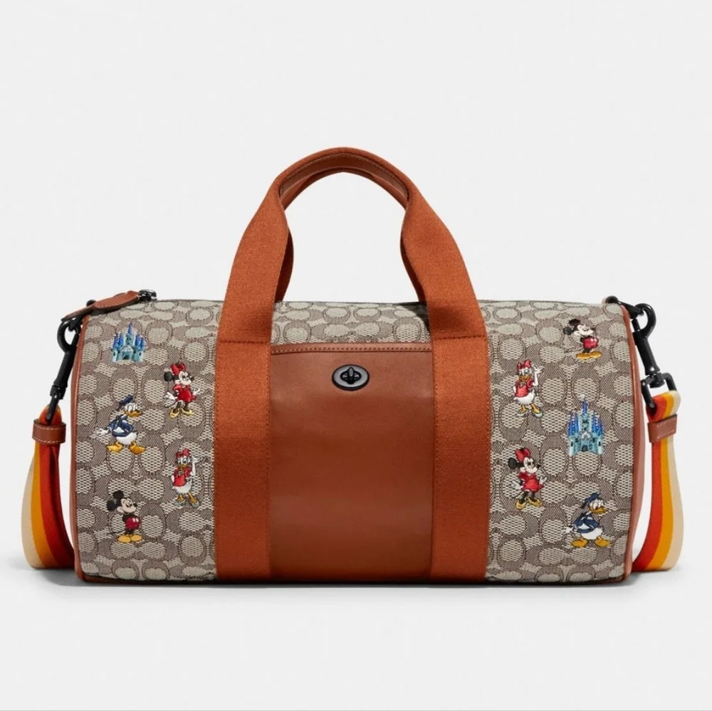 DISNEY X COACH DUFFLE BAG - SIGNATURE TEXTILE JACQUARD MICKEY MOUSE AND FRIENDS
